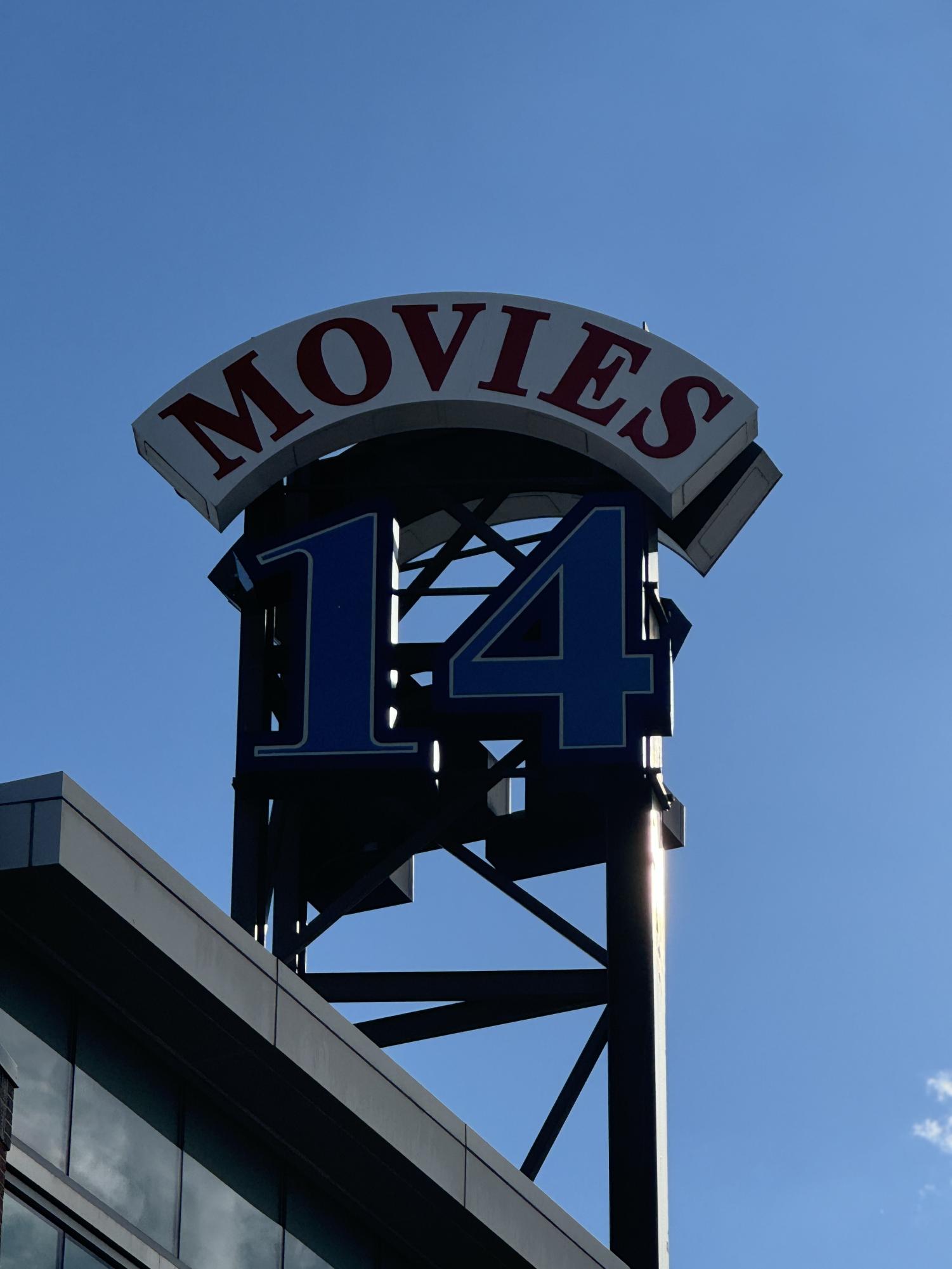 Local movie theater "Movies 14" sign. 