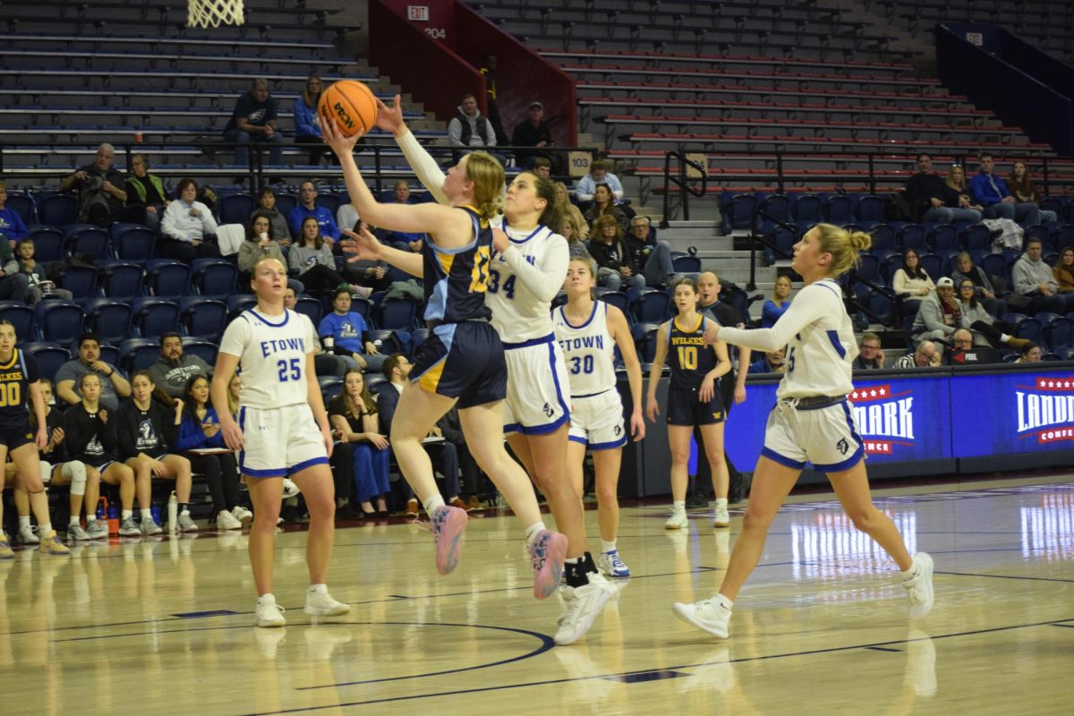 Reagan Holden goes for a layup in Wilkes' loss to Elizabethtown College.